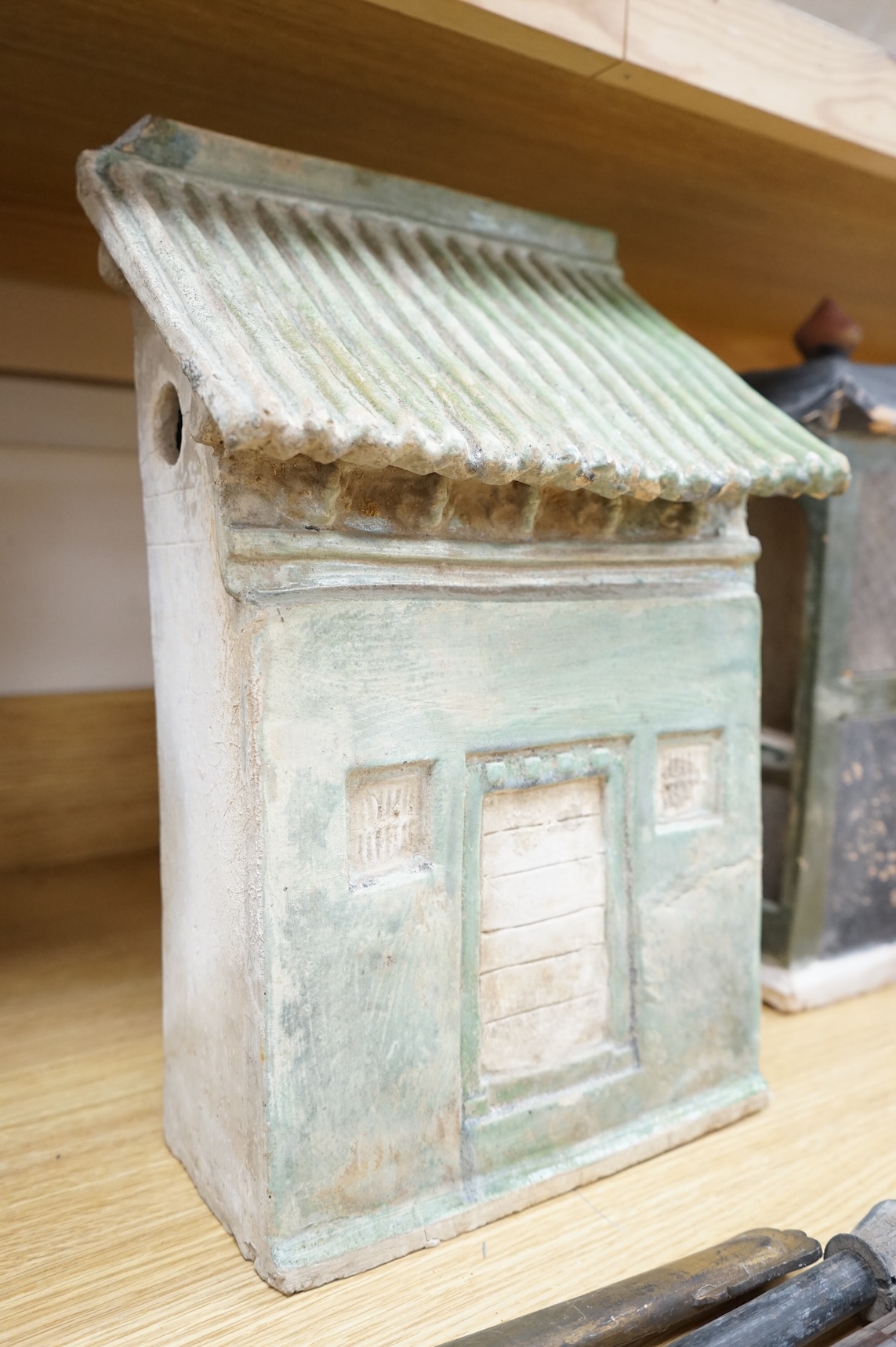 A Chinese Ming sancai glazed model of a cupboard and a shrine, 16th century, 40cm high
